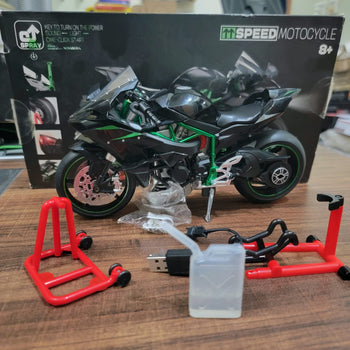 RC motorcycle box contents - remote, stand and accessories